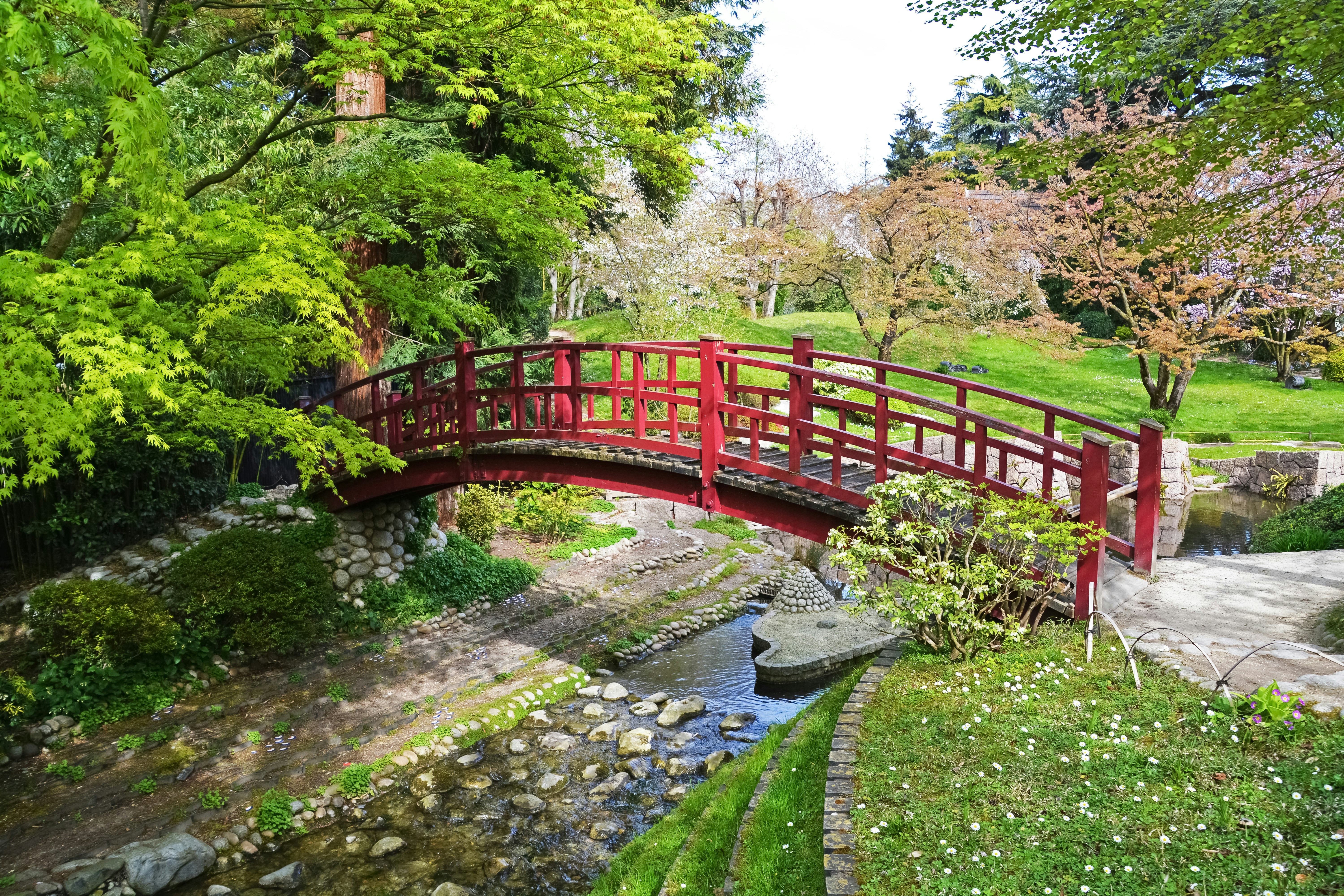 red metal bridge over river